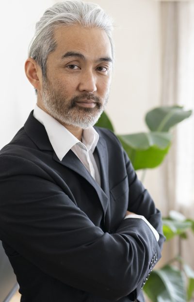 mature japanese businessman with gray hair in office